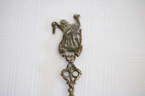 **RS17** Rare antique German made brass plated pewter figural spoon w/ a traditional Dutch pub scene