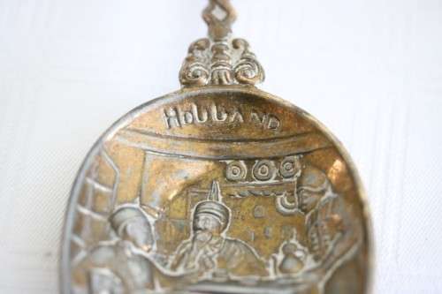 **RS17** Rare antique German made brass plated pewter figural spoon w/ a traditional Dutch pub scene