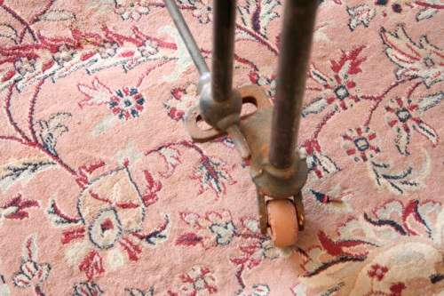 A stunning & rare antique (late 1800's) wrought iron baby's cot w/ dropside on its original castors