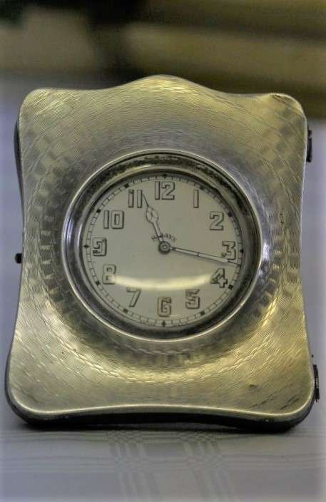 A spectacularly rare antique (1911) Hallmarked sterling silver travel clock w/ a Brevet 33236 watch