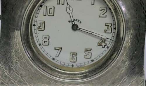 A spectacularly rare antique (1911) Hallmarked sterling silver travel clock w/ a Brevet 33236 watch