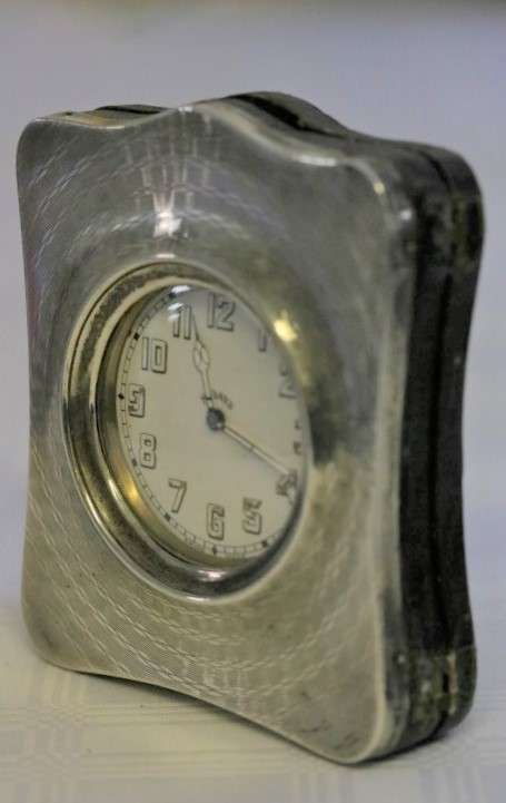 A spectacularly rare antique (1911) Hallmarked sterling silver travel clock w/ a Brevet 33236 watch