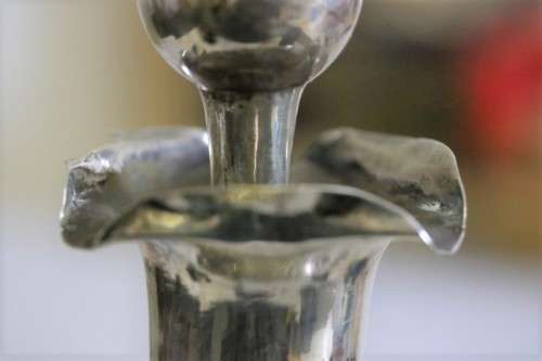 An incredible antique 3-sided 900 solid silver overlay decanter and stopper with a dragon motif