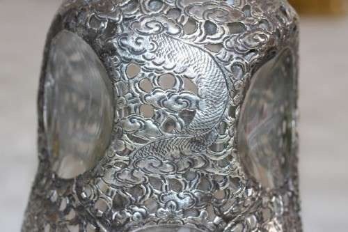 An incredible antique 3-sided 900 solid silver overlay decanter and stopper with a dragon motif