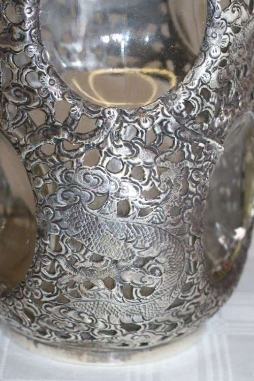 An incredible antique 3-sided 900 solid silver overlay decanter and stopper with a dragon motif
