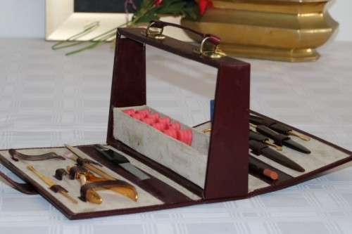 An incredible German made Filax gold plated "Solingen" manicure set in a genuine leather case