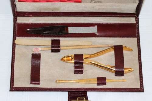 An incredible German made Filax gold plated "Solingen" manicure set in a genuine leather case