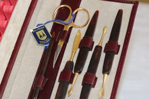 An incredible German made Filax gold plated "Solingen" manicure set in a genuine leather case