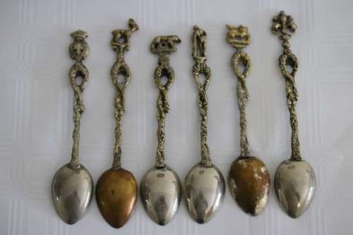 A very rare antique ornate Alpak of Italy silver plated (on brass) teaspoon set with different decal