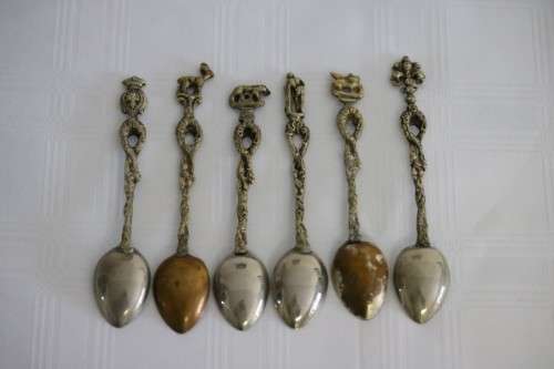 A very rare antique ornate Alpak of Italy silver plated (on brass) teaspoon set with different decal
