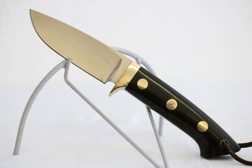 An awesome Piet Cirey "skinning" knife with brass trimmings in its original leather sheath