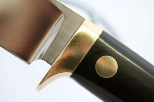 An awesome Piet Cirey "skinning" knife with brass trimmings in its original leather sheath