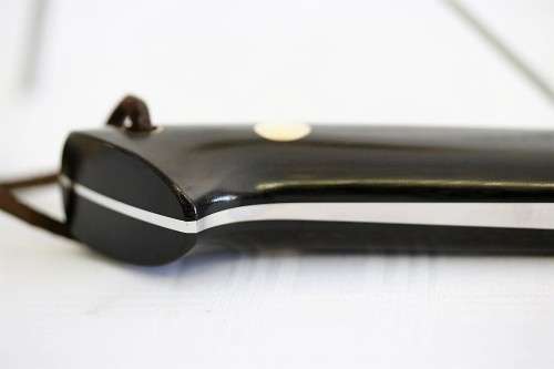 An awesome Piet Cirey "skinning" knife with brass trimmings in its original leather sheath