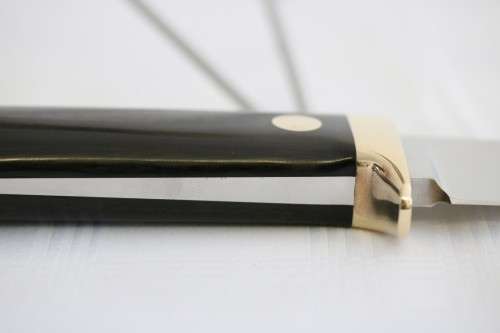 An awesome Piet Cirey "skinning" knife with brass trimmings in its original leather sheath