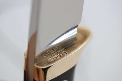 An awesome Piet Cirey "skinning" knife with brass trimmings in its original leather sheath
