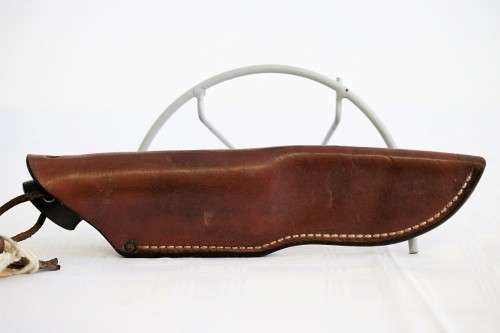 An awesome Piet Cirey "skinning" knife with brass trimmings in its original leather sheath