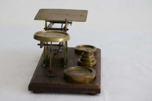 A rare antique British made Victorian brass postal scale w/ solid brass weights in amazing condition