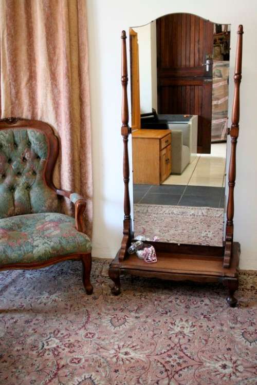 A fabulous antique full length cheval mirror on a solid Imbuia Queen Anne style footed base -RS17Bed