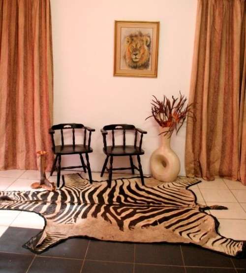 A genuine (large) Zebra skin mat in good condition,fabulous in your lapa, informal living areas