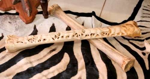 A spectacular and beautifully hand carved "Big five" from a single African Giraffe femur bone