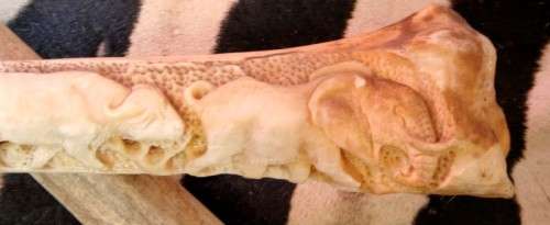 A spectacular and beautifully hand carved "Big five" from a single African Giraffe femur bone
