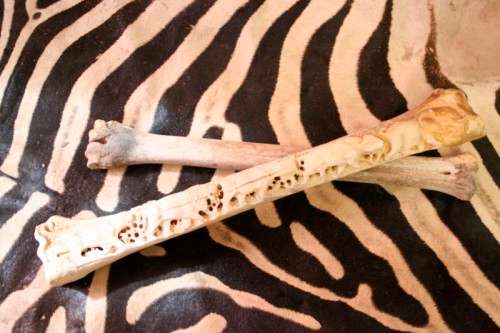 A spectacular and beautifully hand carved "Big five" from a single African Giraffe femur bone