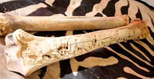 A spectacular and beautifully hand carved "Big five" from a single African Giraffe femur bone
