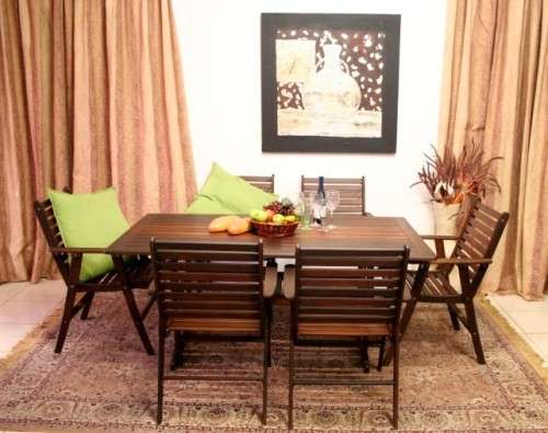 A fabulous modern slatted Teak 6-seater patio/garden set including six cushions.