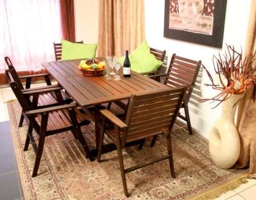 A fabulous modern slatted Teak 6-seater patio/garden set including six cushions.