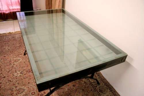Make an offer! Quality 6-seater wrought iron patio table w 6 upholstered chairs. Summer is here!!!