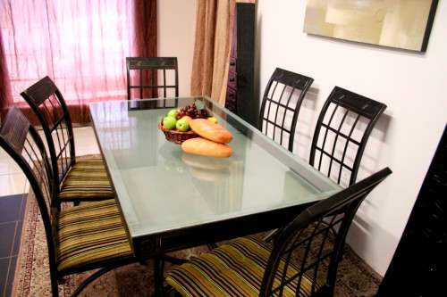 Make an offer! Quality 6-seater wrought iron patio table w 6 upholstered chairs. Summer is here!!!