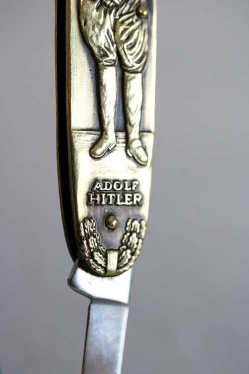 A well-made brass "Solingen, Germany" pocket knife depicting Adolf Hitler - in very good condition!