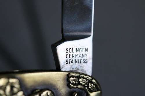 A well-made brass "Solingen, Germany" pocket knife depicting Adolf Hitler - in very good condition!