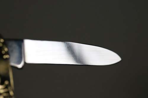 A well-made brass "Solingen, Germany" pocket knife depicting Adolf Hitler - in very good condition!