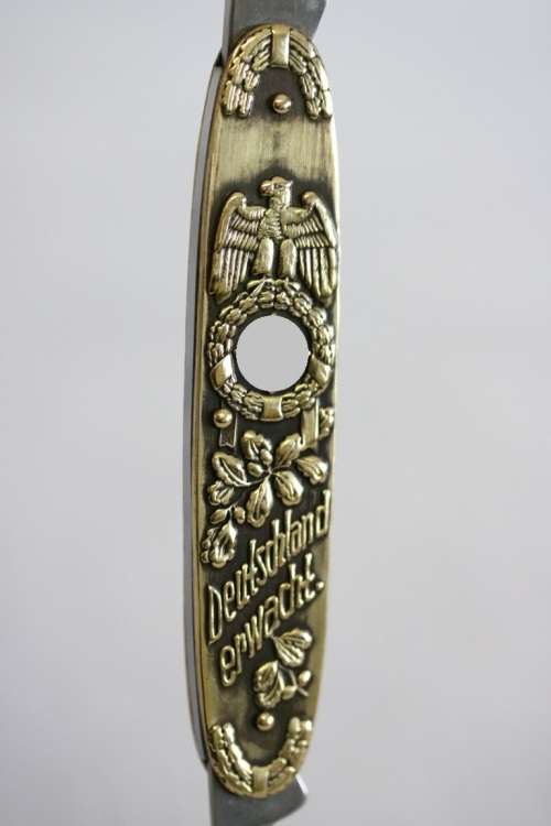 A well-made brass "Solingen, Germany" pocket knife depicting Adolf Hitler - in very good condition!