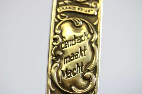 A well-made brass "Solingen, Germany" pocket knife depicting Paul Kruger and "Eendracht Maakt Macht"