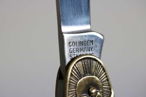 A well-made brass "Solingen, Germany" pocket knife depicting Paul Kruger and "Eendracht Maakt Macht"
