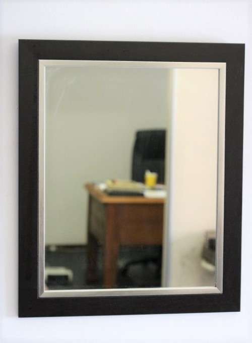 A stylish modern dark wood rectangular wall mirror with brushed steel detailing -  RS17M