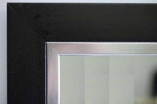 A stylish modern dark wood rectangular wall mirror with brushed steel detailing -  RS17M
