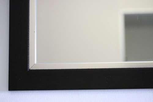 A stylish modern dark wood rectangular wall mirror with brushed steel detailing -  RS17M