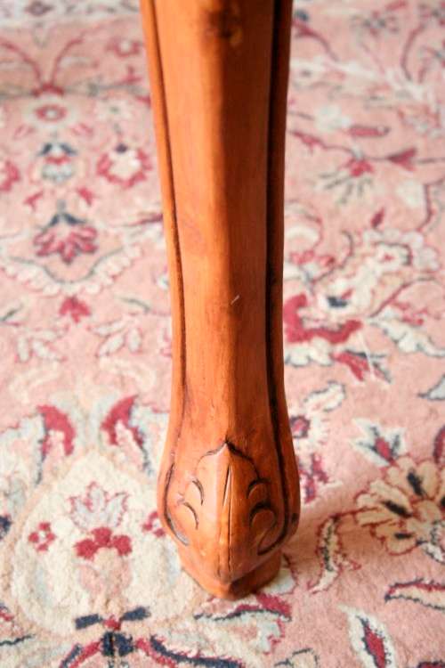 A wonderful and stylish teak side table with a marble top and beautifully carved detailing