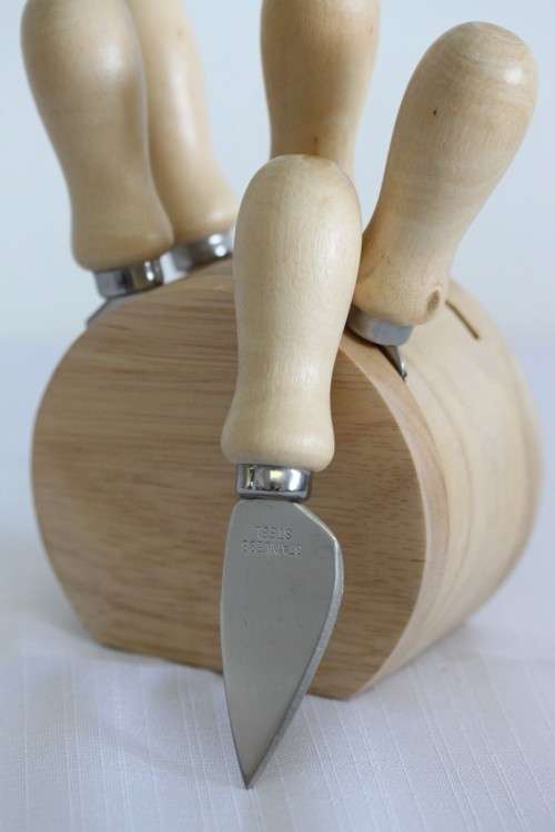 A wonderful stainless steel cheese knives and fork set in a wooden holder - an amazing gift!