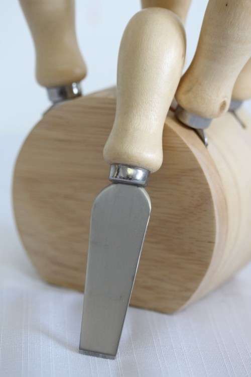 A wonderful stainless steel cheese knives and fork set in a wooden holder - an amazing gift!