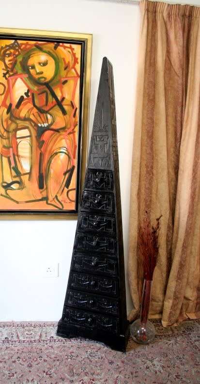 An extraordinary, tall Indonesian pyramid chest of drawers with beautiful carved detailing - amazing