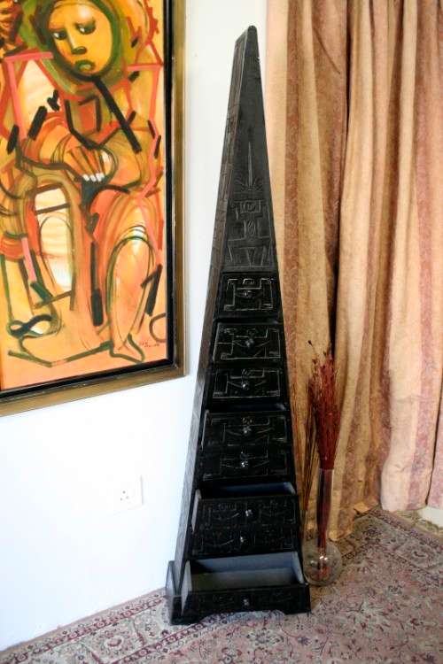 An extraordinary, tall Indonesian pyramid chest of drawers with beautiful carved detailing - amazing