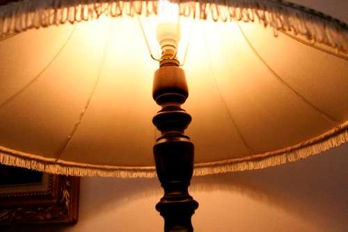 An exquisite tall solid Teak Barley-twist floor lamp with a large shade in working order