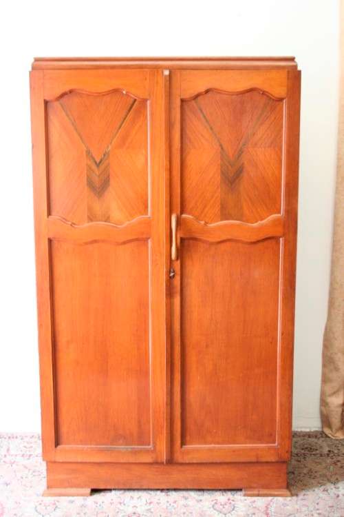 A stunning vintage double-door Oak wardrobe with racks and drawers.