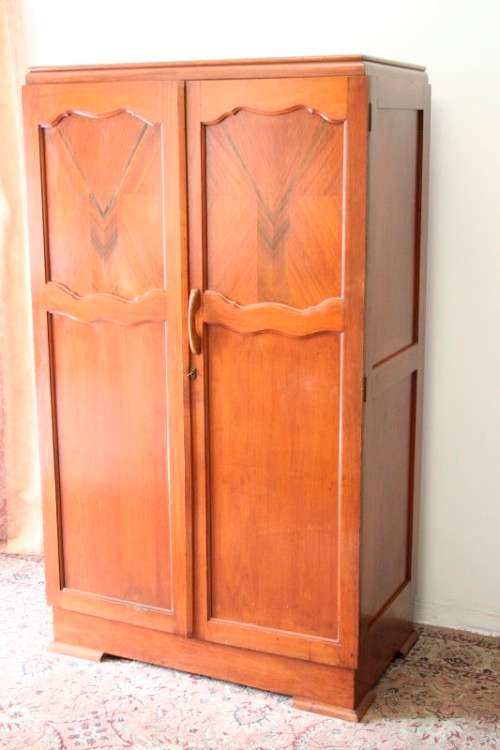A stunning vintage double-door Oak wardrobe with racks and drawers.
