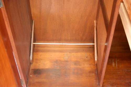 A stunning vintage double-door Oak wardrobe with racks and drawers.