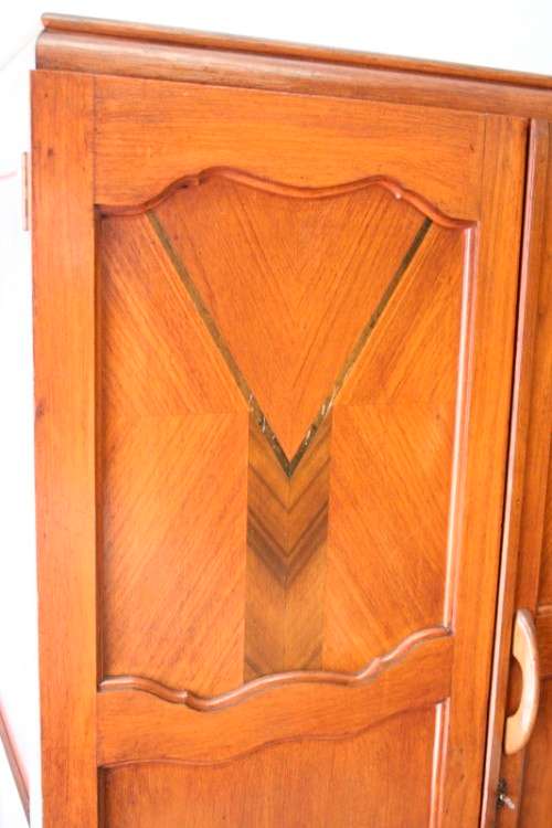 A stunning vintage double-door Oak wardrobe with racks and drawers.